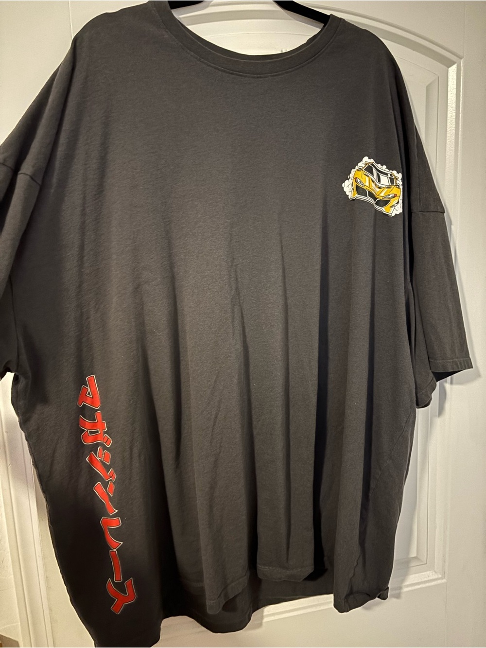 Men's Black Graphic Tee with Yellow Car Detail